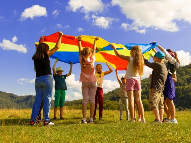 Children Waving a Big Kite